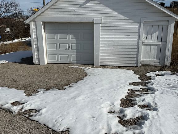Detached garage. Portion with garage door available to tenant. Portion with regular door reserved for landlord's supplies.