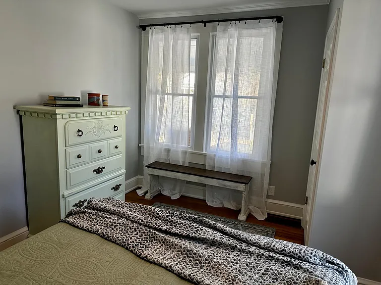Guest bedroom with closet and dresser