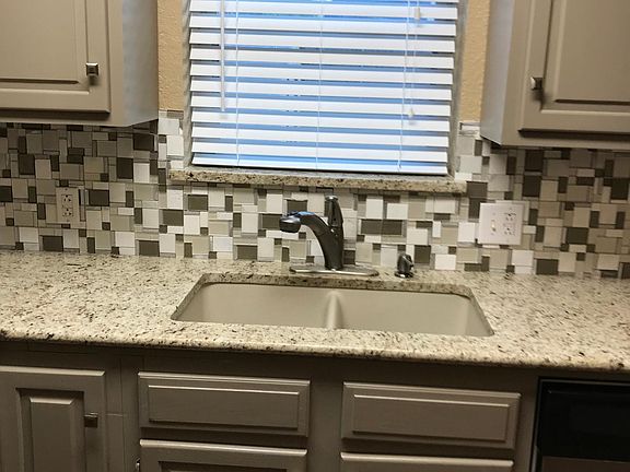 Kitchen ceramic sink and granite counters