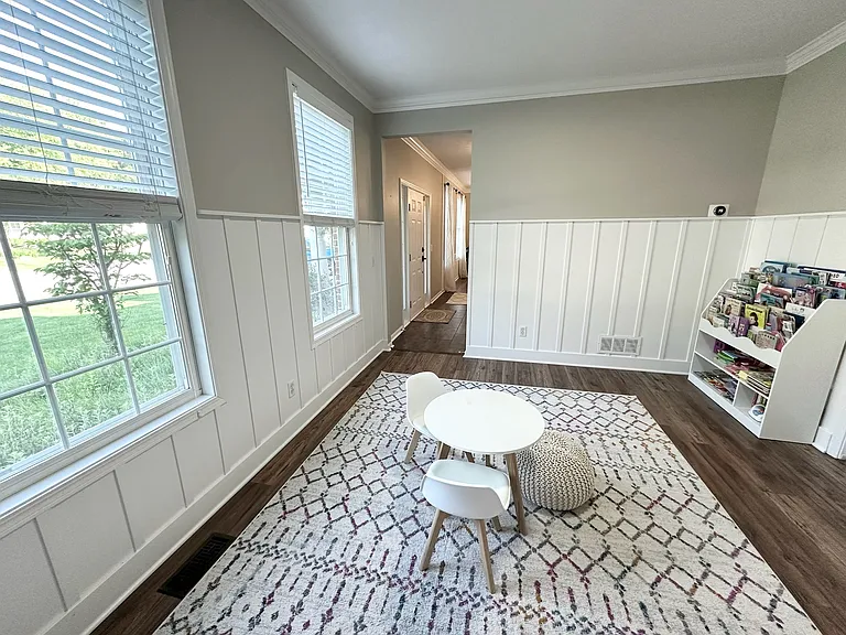 Main floor office / kids play area with pocket doors