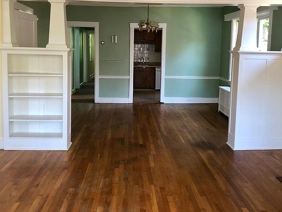 Living room, dining room with kitchen and hallway in the back