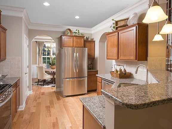 Beautiful tiered cabinetry and optional crown moulding highlight this highly functional kitchen. Opt
