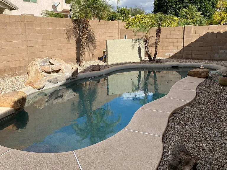 pebble stone pool with waterfall