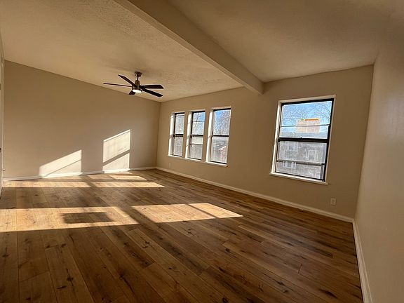 HUGE living room with south-facing windows, luxury cordless cloth blinds, and coat closet! Stay comfortable with central air conditioning, central heat, and brand-new luxury ceiling fan with tons of light modes, fan speeds, and timers!