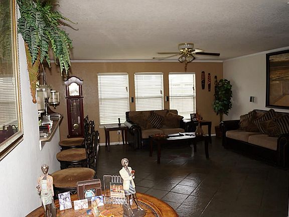 Living room area with tile flooring.