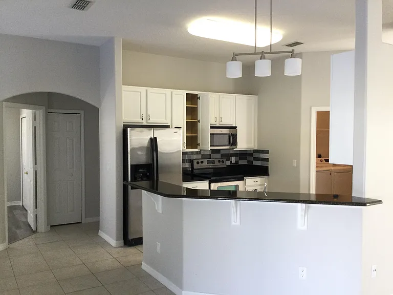 Barstool area opens to breakfast, family room