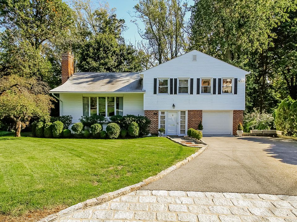 Pristine 1958 Split in Vernon Hills Estates. Driveway with Belgian Block Apron, Slate walkway, Anderson Vinyl Windows and Sliding doors, Underground Sprinkler, Outside deck with piped in Gas Barbecue, Two Car Tandem Garage, Private Wooded back yard.