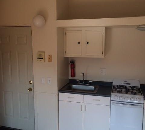 Cute strip kitchen with gas stove