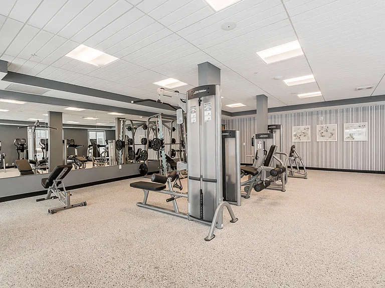 Our expansive fitness center feels like a true gym with cardio equipment, weightlifting machines and free weights.