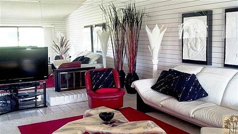 the vaulted ceiling helps amplify the room