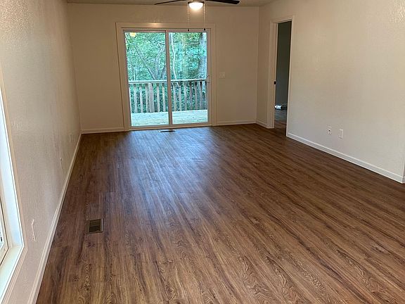 Spacious living and dining space with private view