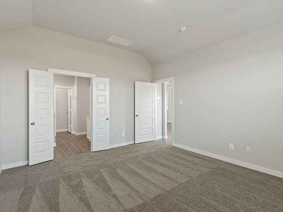 Primary Suite in the Elm home plan by Trophy Signature Homes - REPRESENTATIVE PHOTO