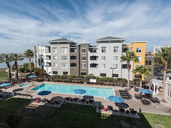 Swimming pool with sundeck, lounge seating