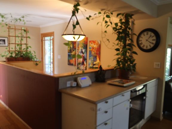 View of the stair well to garage and family room