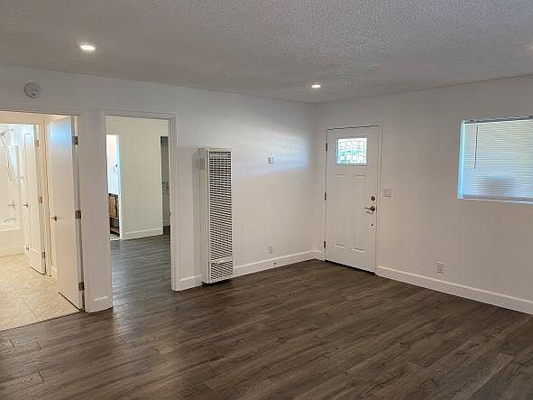 Living room, Laundry room & Full bath (left), Master bedroom & Half bath (background right)