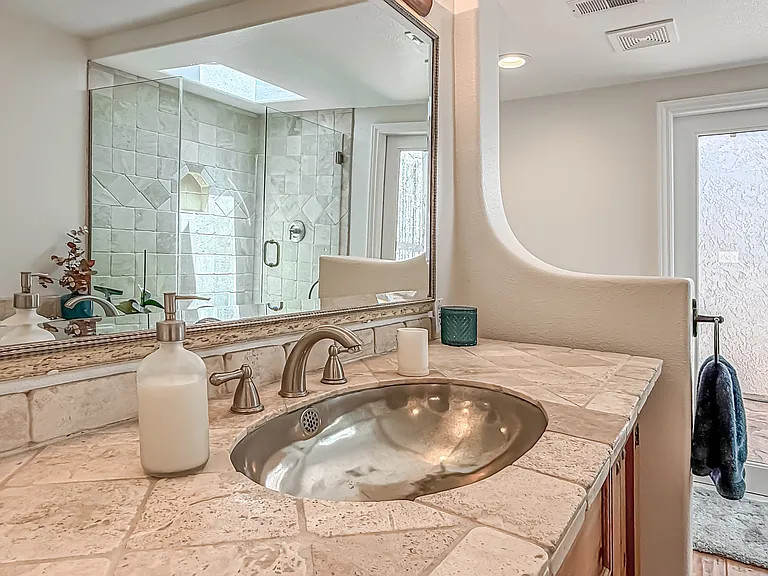 Primary vanity with nickel plated sink