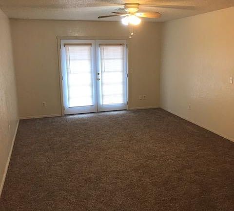 Living room with French doors to backyard