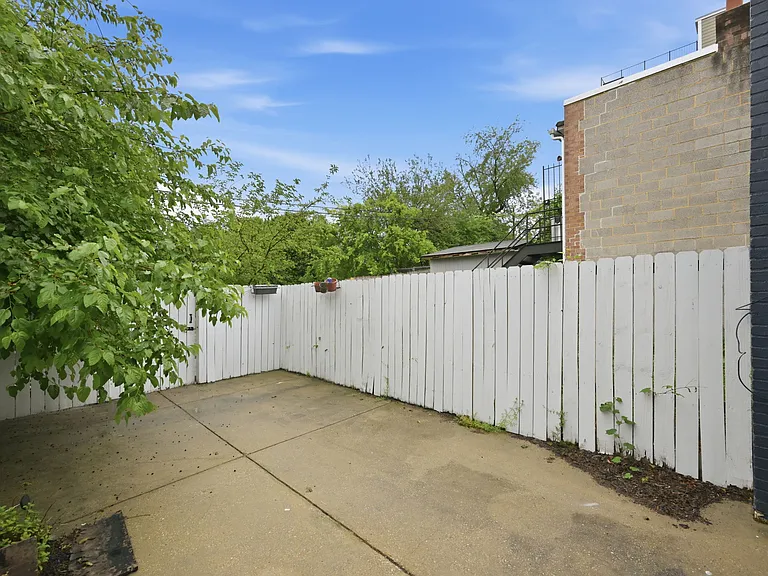 Exterior Rear View of Large Outdoor and Parking Area