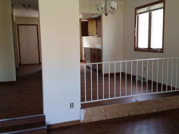 from living room, past dining room, into kitchen