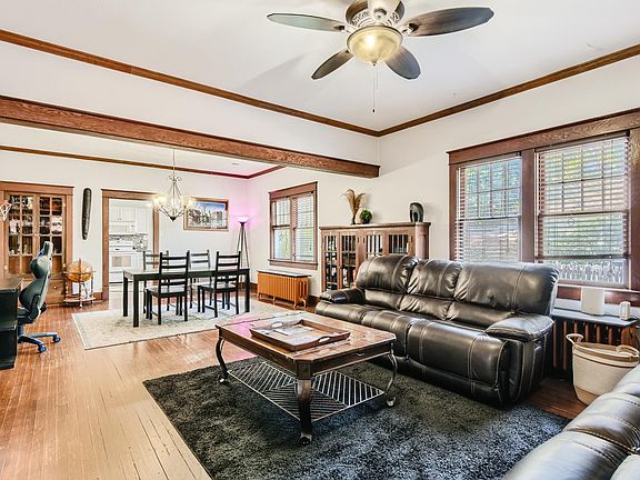 Living room, looking to dining and kitchen.