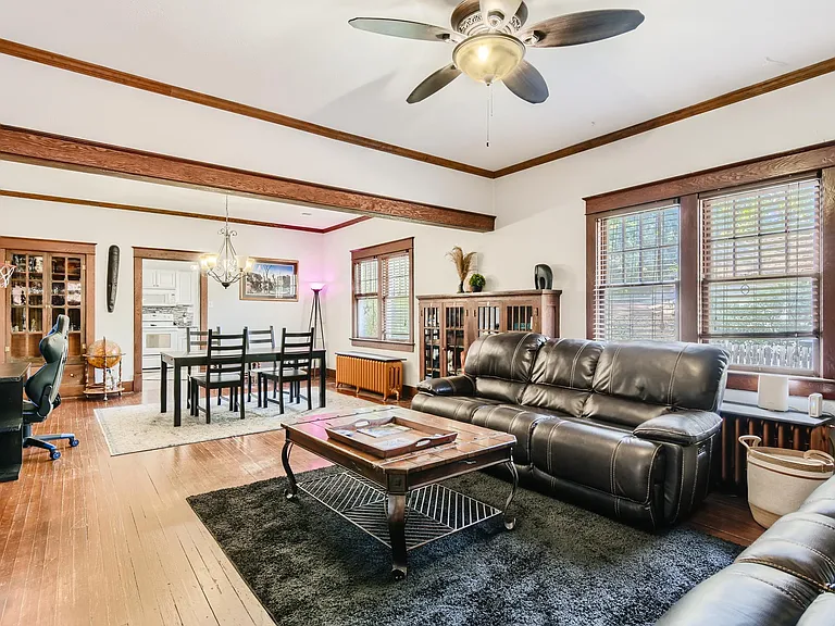 Living room, looking to dining and kitchen.