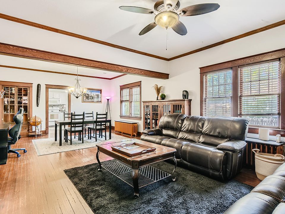 Living room, looking to dining and kitchen.