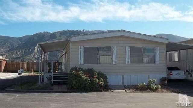This nice Mfg. home, located in an affordable Sr. park, has 2 bedrooms, 2 baths, a lovely dining area with a built-in buffet and includes the washer, dryer, gas range & refrigerator!  Forced Air heating, central air conditioning, a nice backyard and great