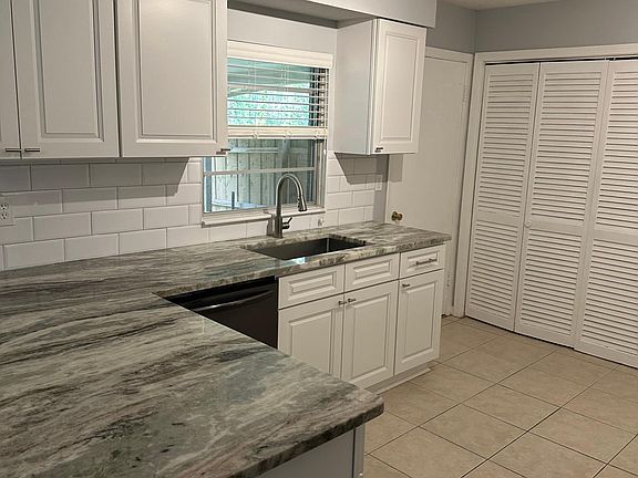 Updated kitchen with new granite countertops and appliances and subway tile backsplash. Soft close cabinets and under counter sink.