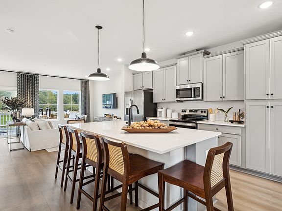 Kitchen with pendant lights over island