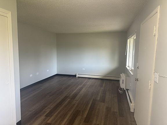 Living room opens to kitchen area