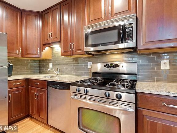 Lovely granite, tile and  stainless appliances