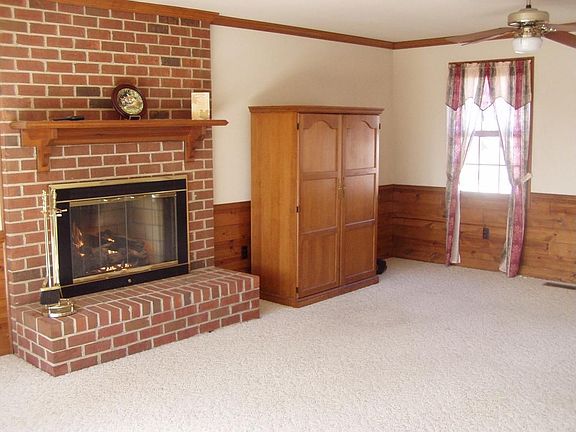 Family room with fireplace with realistic gas logs
