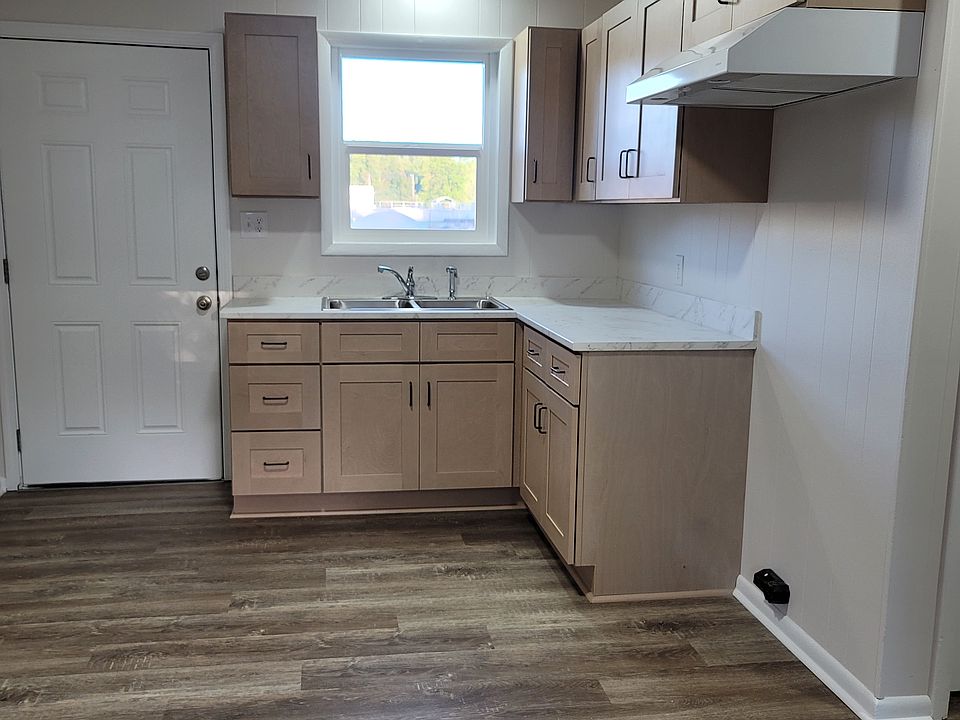 The kitchen will have the stove and refrigarator. The cabinets, countertops, sink and vent hood are all new.