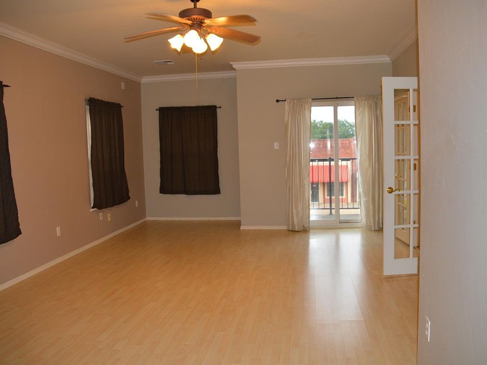 Living Room with access to small balcony ioverooking Downtown Tecumseh.