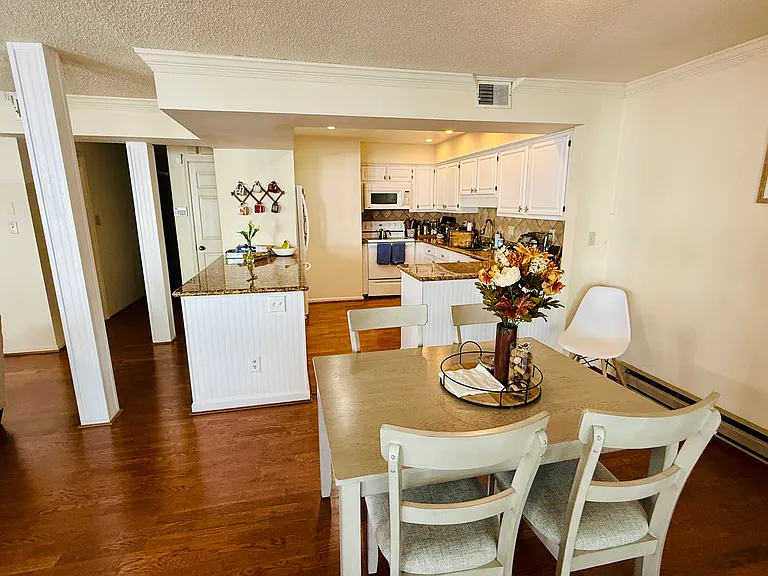 View walking in from the sunroom at the front of the unit