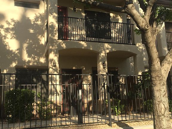 Large tree provides some shade to the patios that look out onto the greenbelt.