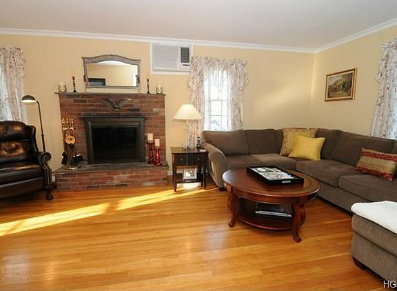 Living room with brick fireplace.