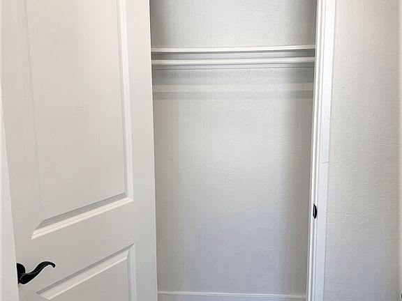 Coat closet behind entry door, great for storage!