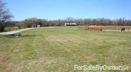 Front pasture
						:
						Front pasture as seen from the front gate. House sits back in the trees.