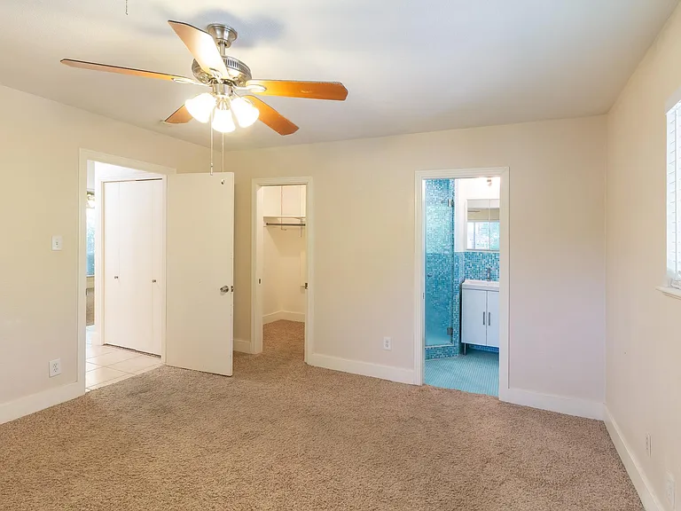 primary bedroom. master closet on left, bath on right
