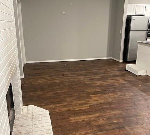 Dining area with kitchen to the side.