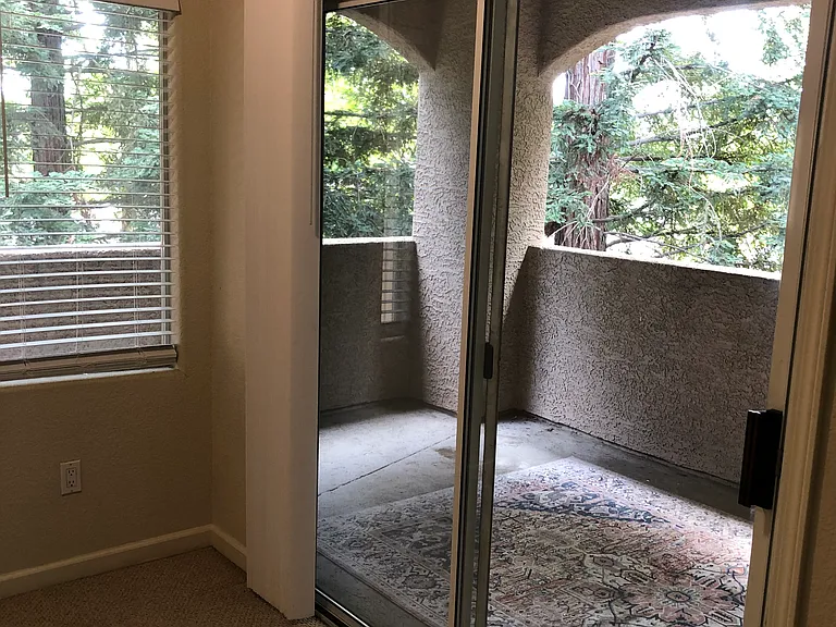 Huge wraparound covered patio overlooking parklike setting.
