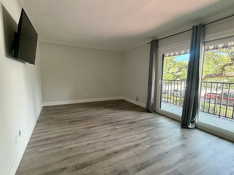 Primary bedroom with balcony access