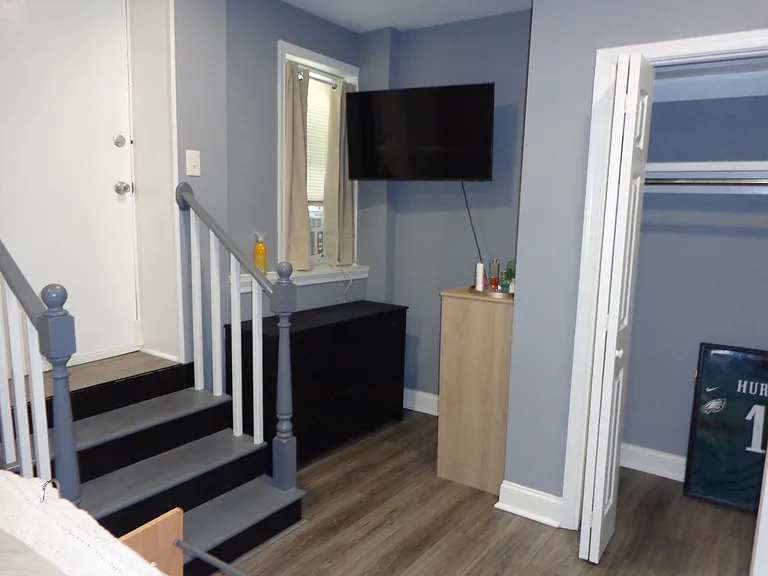 Bedroom with TV, Dressers, Rear Entrance