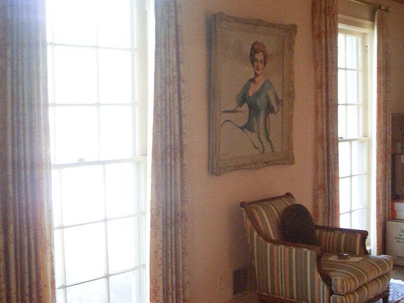 Living room with 1 of 2 fireplaces in the home.