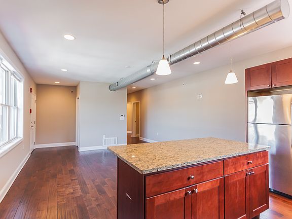 Kitchen Island and Reverse View of Living Room/Dining Room
