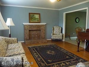 Fireplace is tiled to match kitchen
