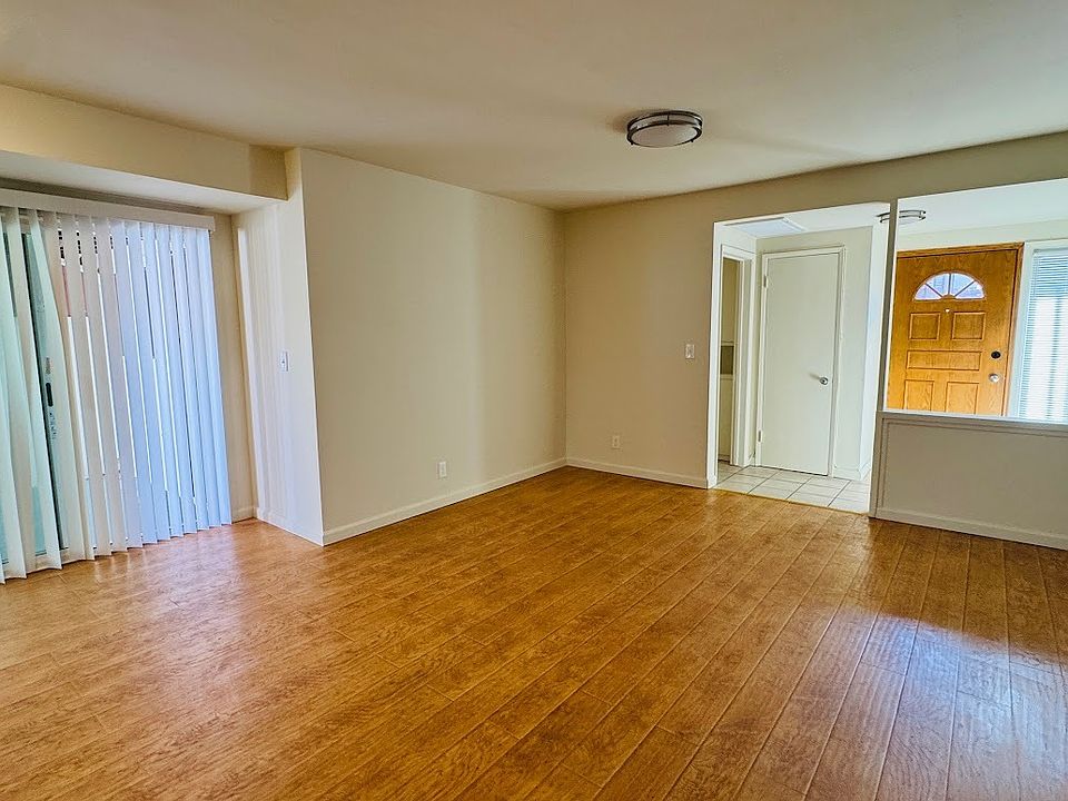 Living Room and Entry. Sliding door to private patio on the left.
