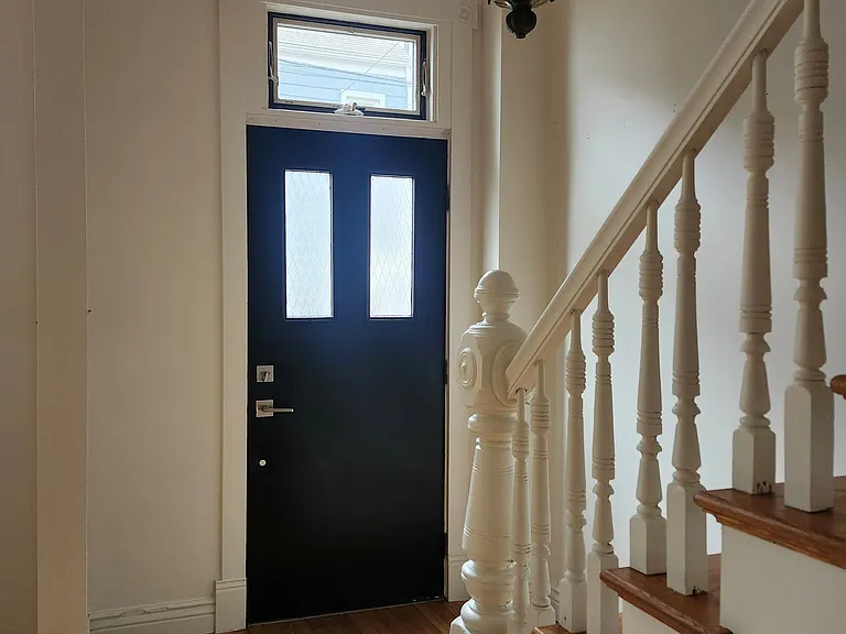 Foyer with newly added drop off zone and coat shelving unit. Picture not shown.