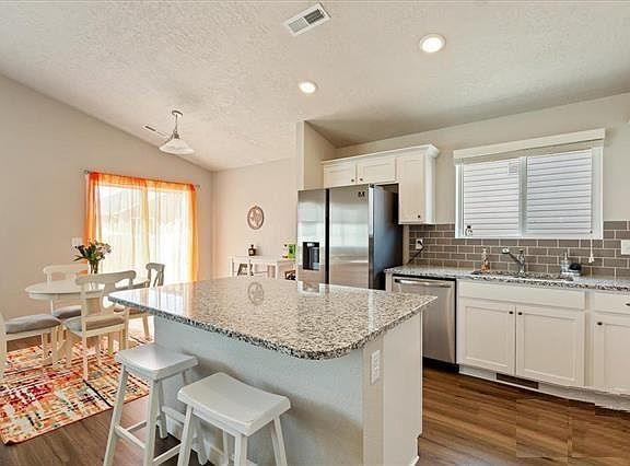 Delightful Kitchen with Stainless steal appliances and granite countertops